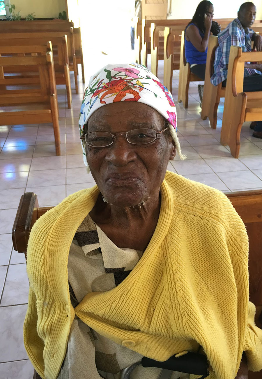 Elderly woman in Haiti wearing new eyeglasses received through God’s Eyes vision outreach.